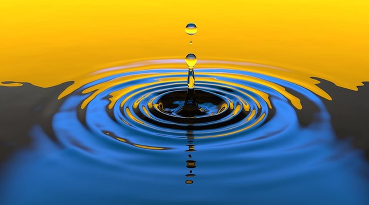 Gota d'água caindo e formando ondas, simbolizando a urgência e frequência urinária
